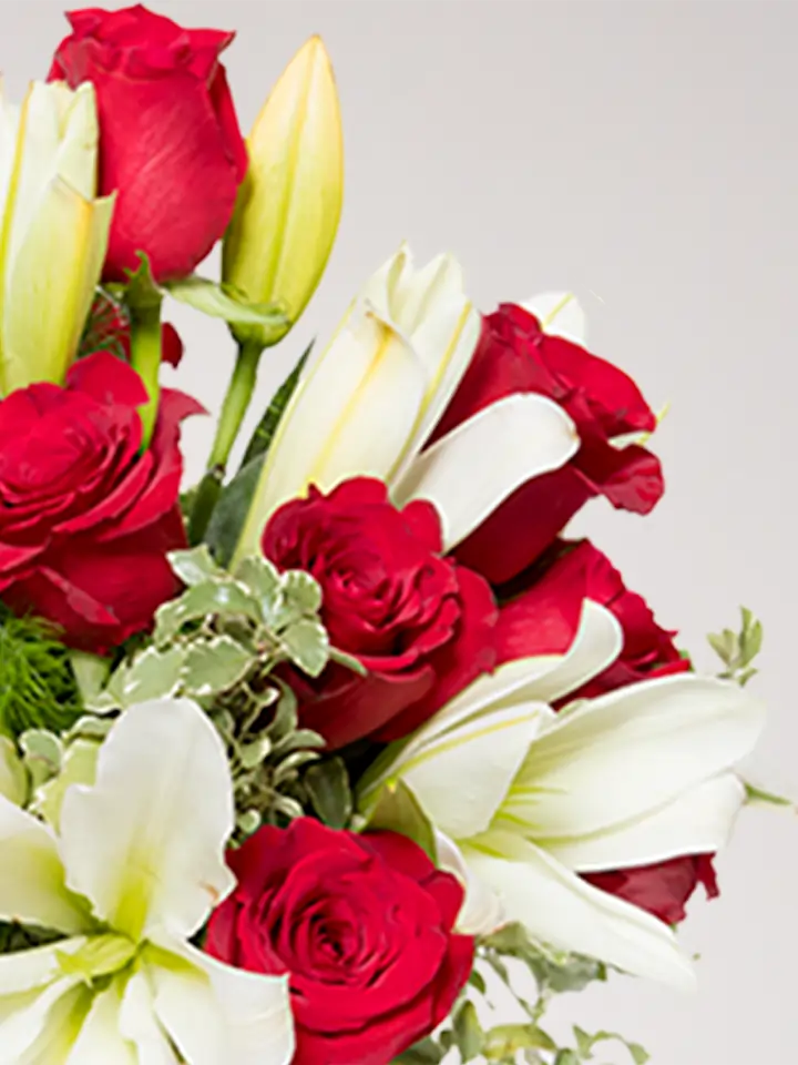 Bouquet of red roses and white lilies delivered to